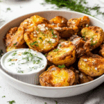 Parmesan smashed potatoes served with dipping sauce