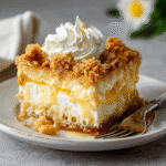 lemon cream cheese dump cake in rustic baking dish
