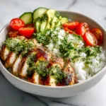 Chimichurri grilled chicken bowl with avocado and fresh vegetables